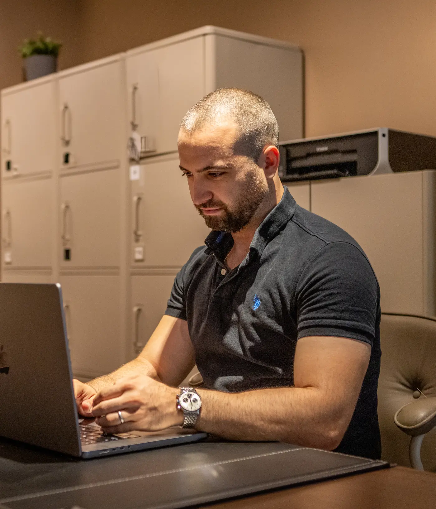 The Nine Taps founder working at a laptop