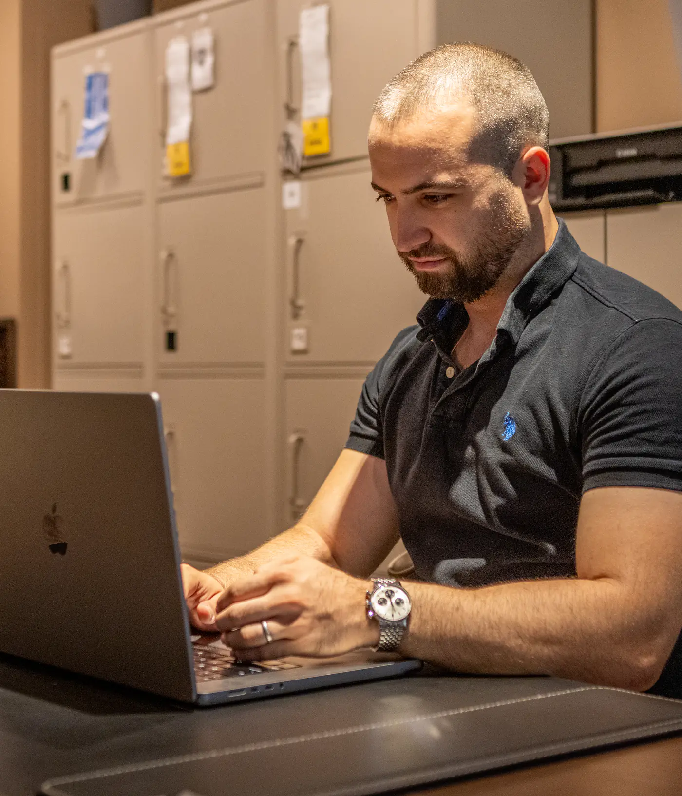 The Nine Taps founder working at a laptop
