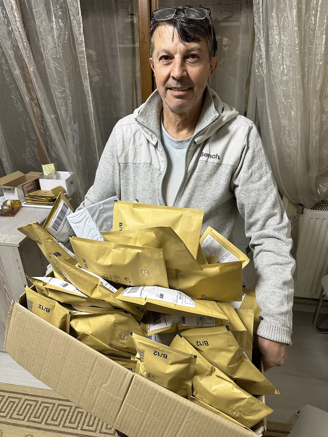 Kolyo Marinov holding a box of packed orders